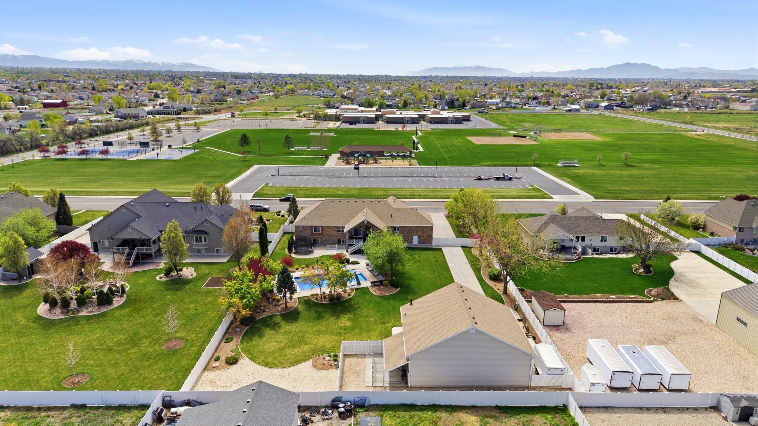 Aerial perspective of suburban area with a mountainous background