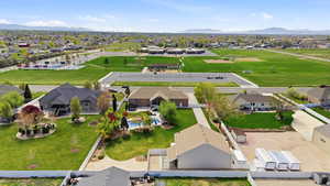 Aerial perspective of suburban area with a mountainous background