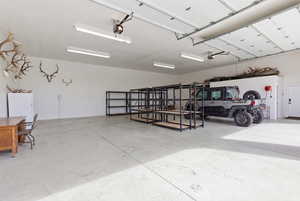 Garage with freestanding refrigerator