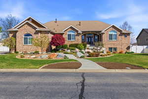 Single story home featuring brick siding and roof with shingles