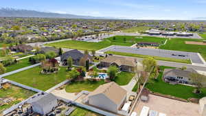 Aerial perspective of suburban area with a mountain backdrop