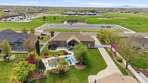 Aerial view of residential area featuring a pool area