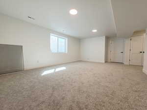 Unfurnished bedroom with carpet floors and baseboards
