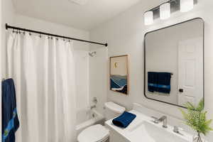 Full bathroom with vanity and shower / bathtub combination with curtain