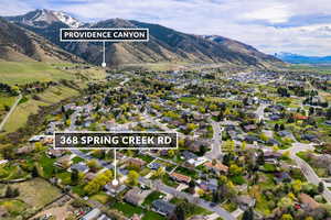 Aerial perspective of suburban area featuring a mountainous background