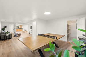 Playroom with light wood finished floors and baseboards