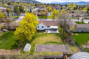 Aerial perspective of suburban area featuring a mountainous background