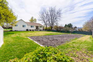 Rear view of house featuring a patio and crawl space