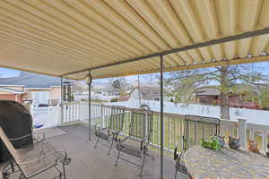 Fenced backyard featuring grilling area, a residential view, and a patio area