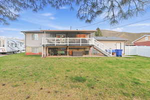 Rear view of house with a patio and a deck