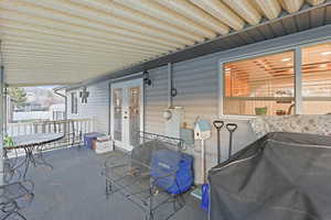 View of patio / terrace featuring french doors, a mountain view, and outdoor dining area