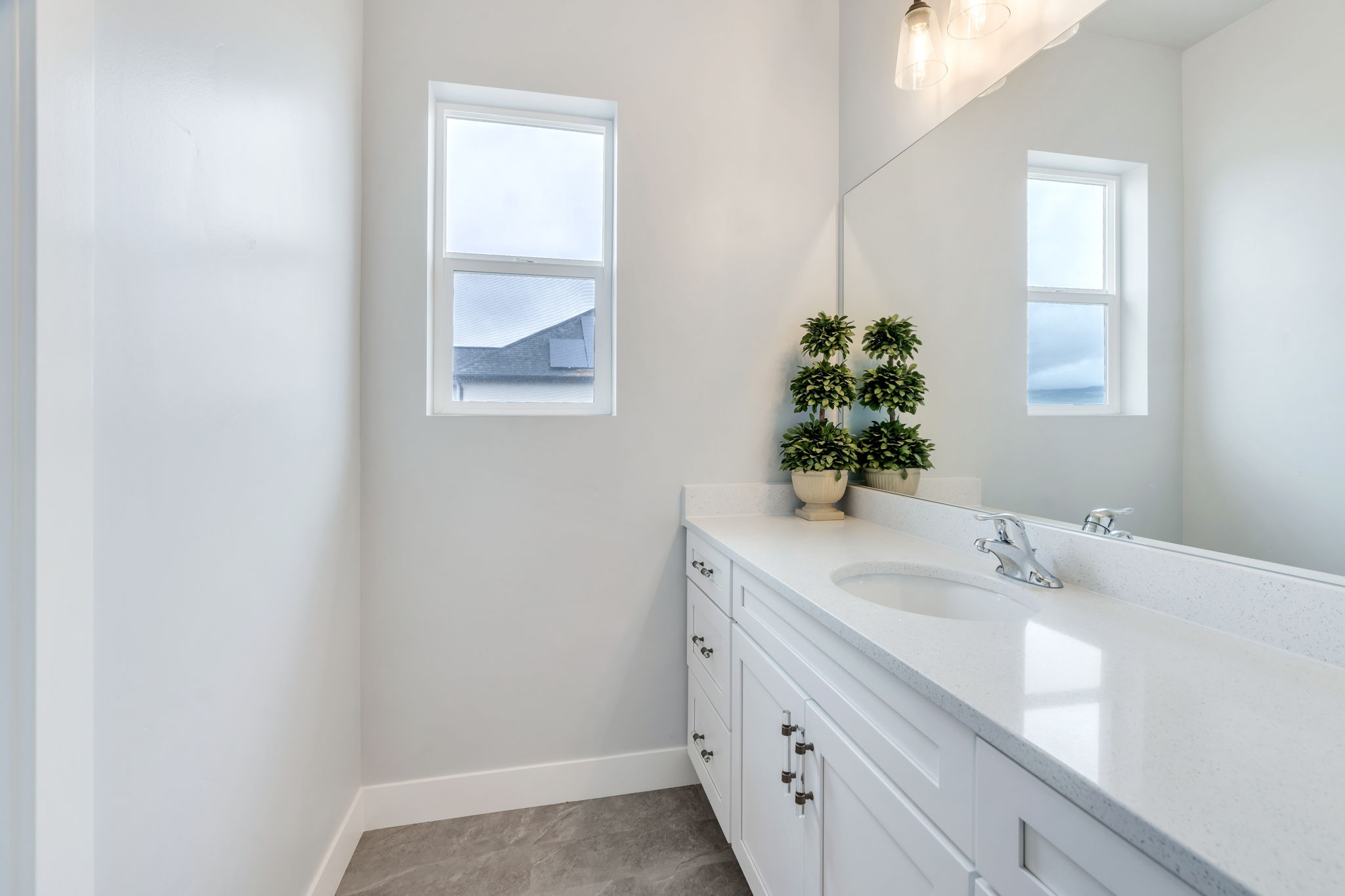 Bathroom with vanity and healthy amount of natural light
