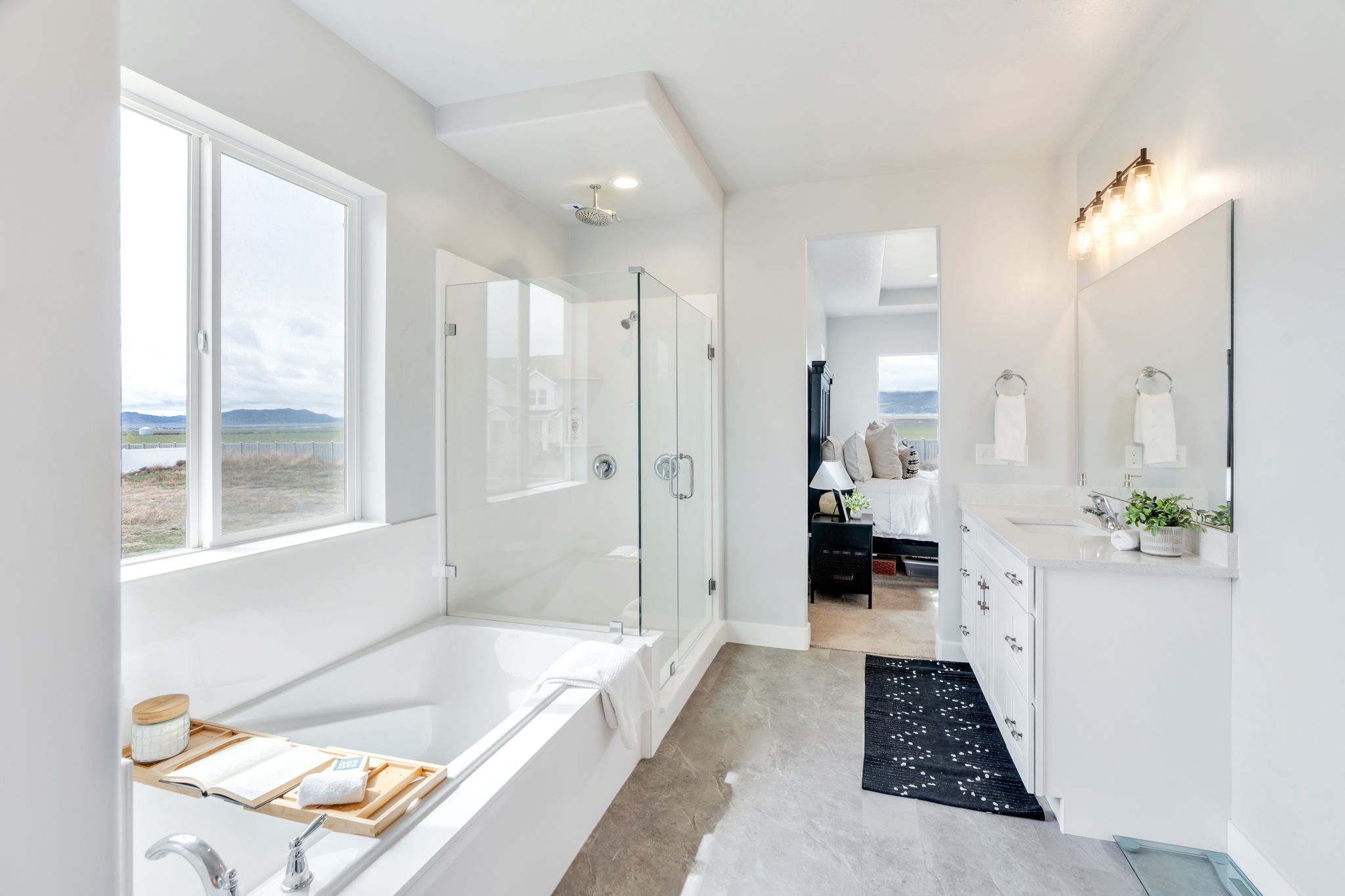 Full bath featuring a stall shower, ensuite bath, vanity, and a garden tub