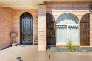 Entrance to property with brick siding