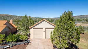 Garage featuring a mountain view