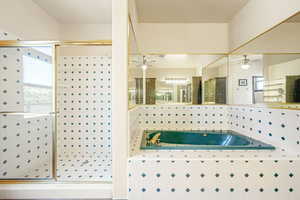 Full bath with a garden tub and a shower stall