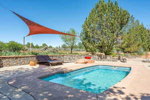 Outdoor pool with a patio area