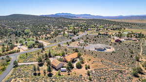 Drone / aerial view of a mountainous background and a desert landscape