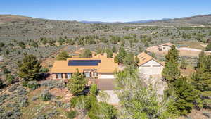 Overview of rural landscape featuring a mountainous background and a desert landscape