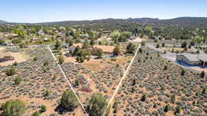Aerial view of a mountainous background and a desert landscape