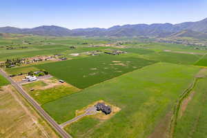 Overview of rural landscape featuring a mountain backdrop