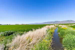 View of mountain background featuring rural landscape