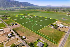 View of rural area featuring a mountain backdrop and property boundaries highlighted