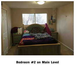 Bedroom featuring a closet and light carpet