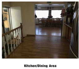 Hallway featuring dark wood-style floors