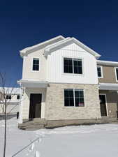 View of front of home featuring stone siding