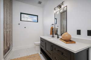 Bathroom with vanity and a shower with shower curtain
