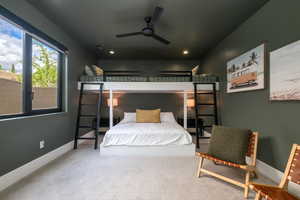 Bedroom featuring light carpet, ceiling fan, and recessed lighting