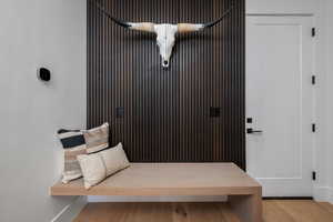 Mudroom featuring baseboards and light wood-type flooring