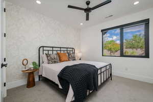 Bedroom featuring light colored carpet, a ceiling fan, recessed lighting, and wallpapered walls