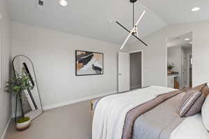 Master bedroom with vaulted ceiling, custom lighting, and tons of natural light