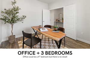 Office with dark wood-type flooring