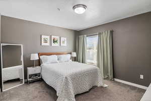 Primary bedroom with shared bathroom.