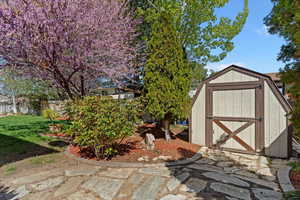 View of shed featuring a fenced backyard