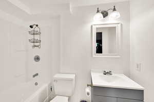 Bathroom featuring vanity and tub / shower combination