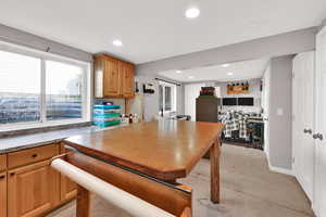 Dining space with recessed lighting and baseboards