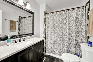 Full bath featuring vanity and a shower with curtain