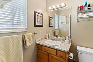 Bathroom with toilet and vanity