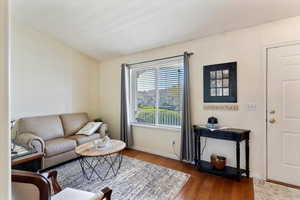Living room with wood finished floors and baseboards