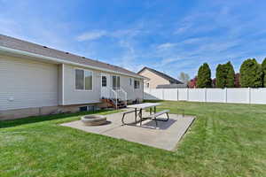 View of yard featuring a patio and an outdoor fire pit