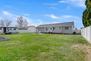 Back of property featuring a patio area, entry steps, and a fenced backyard