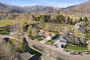 View of property location with mountains and nearby suburban area