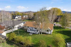 Aerial perspective of suburban area with a mountain backdrop