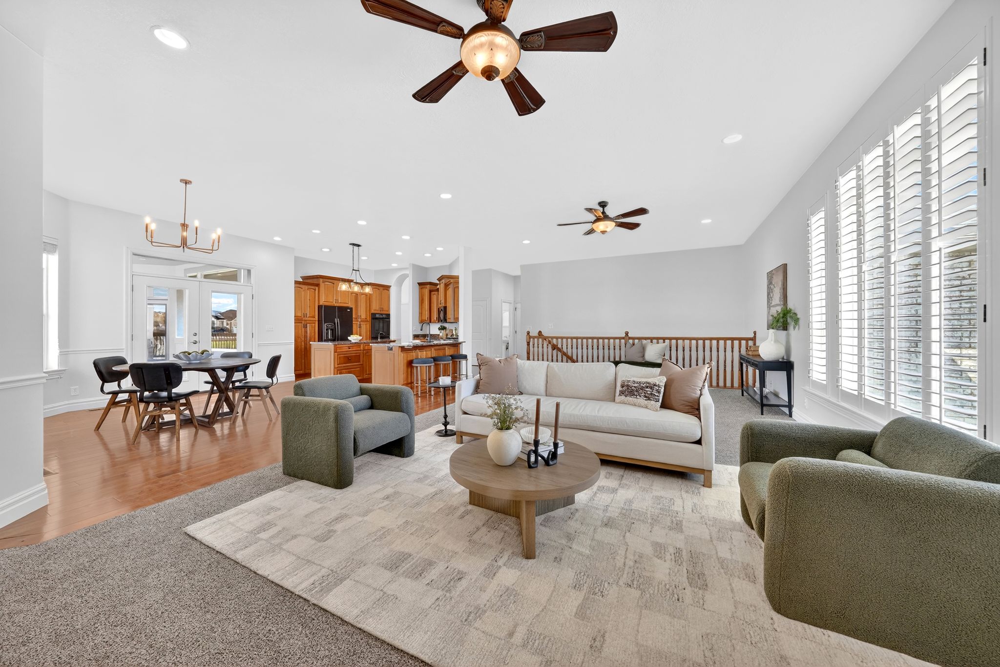 Living area featuring a chandelier and light colored carpet