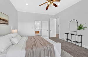 Carpeted bedroom featuring ornamental molding, ceiling fan, ensuite bathroom, and recessed lighting