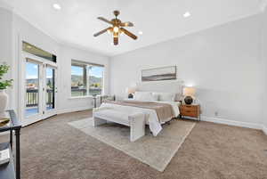 Bedroom with light colored carpet, access to exterior, ornamental molding, a ceiling fan, and recessed lighting